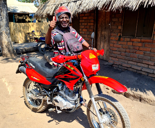 Shadrick is grateful for his motorbike so he can visit beach village committees in Malawi Shadrick is grateful for his motorbike so he can visit beach village committees in Malawi