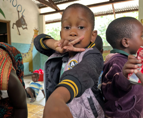 Andrew loves to strike a pose when the camera comes out in Malawi