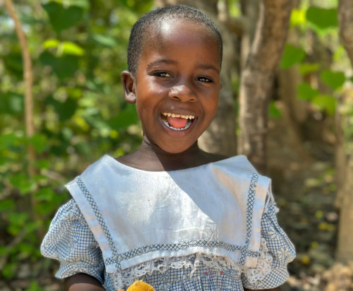 Memory is very happy to attend preschool in Malawi