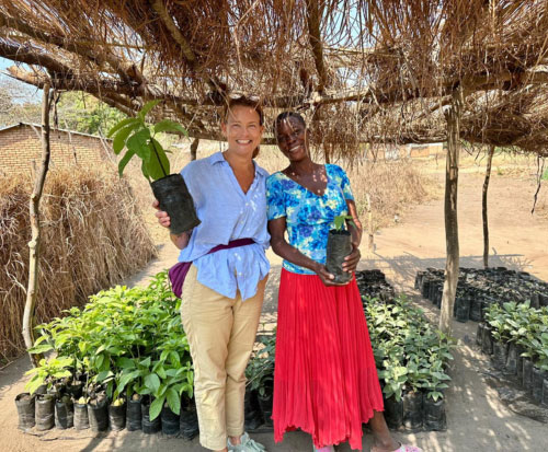 Volunteer Hayley visiting our fruit tree project in Malawi