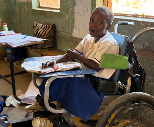 Faith is learning at school now thanks to having a wheelchair