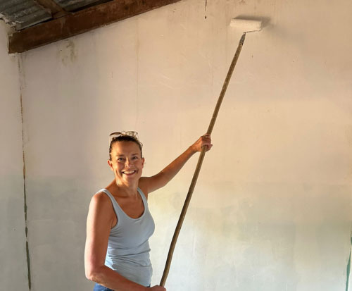 Hayley painting a preschool
