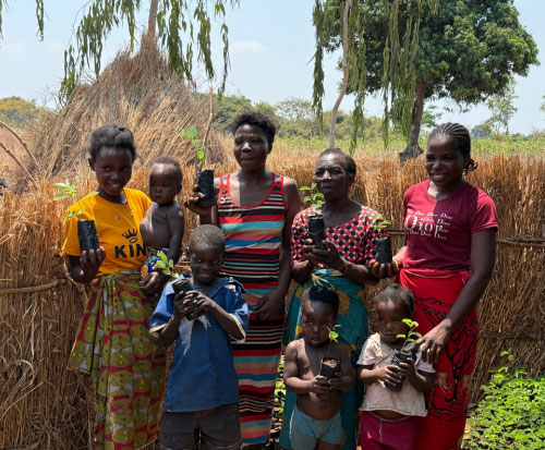 Tree planting Club smiling with their seedlings