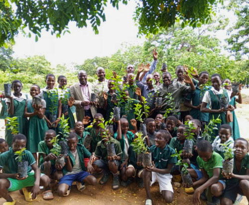School group with fruit tree seedlings