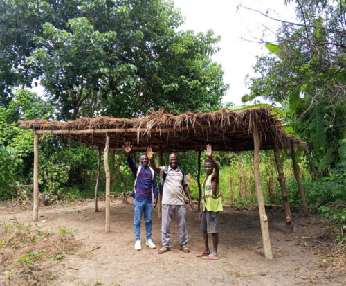 Our team waving hello from a tree shade