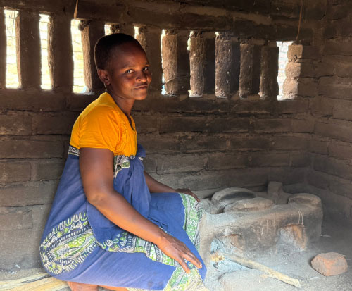 Eloofa sat beside her fuel-efficient cookstove