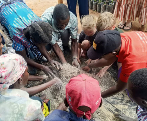 Reuben and Alice working on manure making