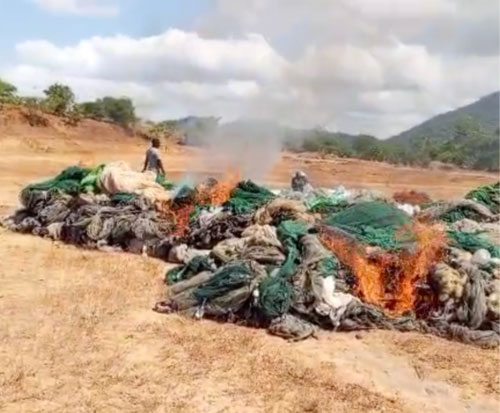 Confiscated illegal fishing nets being burnt