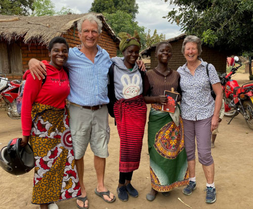Geoff and Liz stood with some of our cookstove team