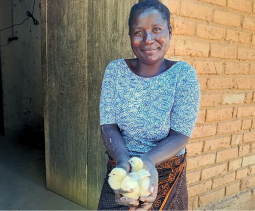 Club member with her baby chicks