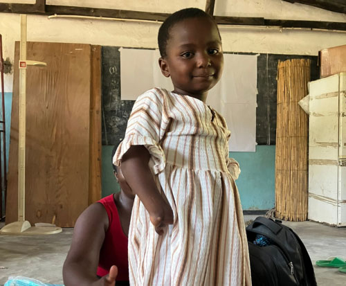 Miracle is now able to write and is attending school