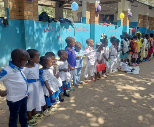 Preschool graduates stood in front of their pre-school