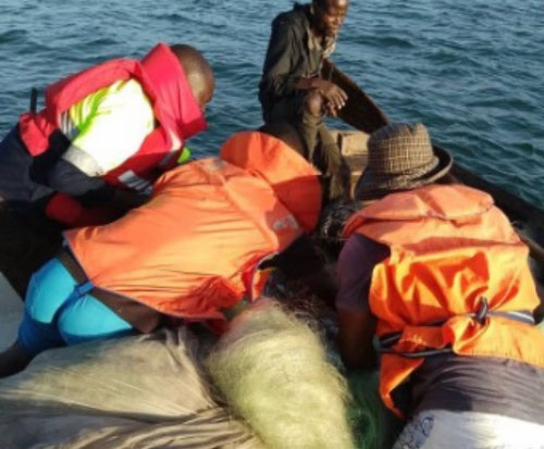Team pulling out illegal fishing equipment