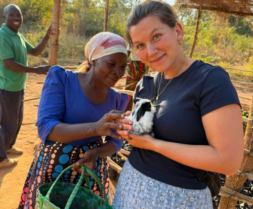 Flora with a community club member
